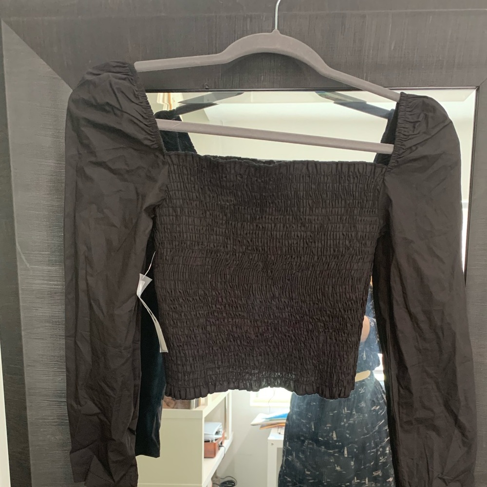 New with tags. Chic and beautiful black top